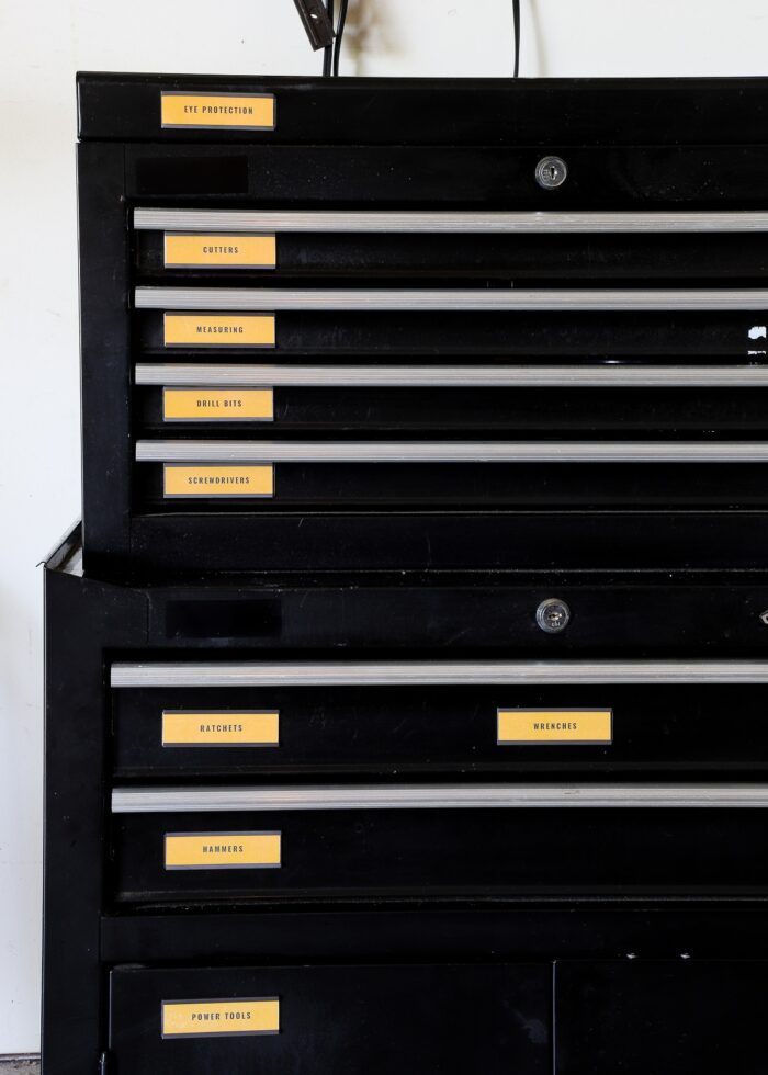 Black Husky toolbox with yellow magnetic toolbox labels on the front of each drawer