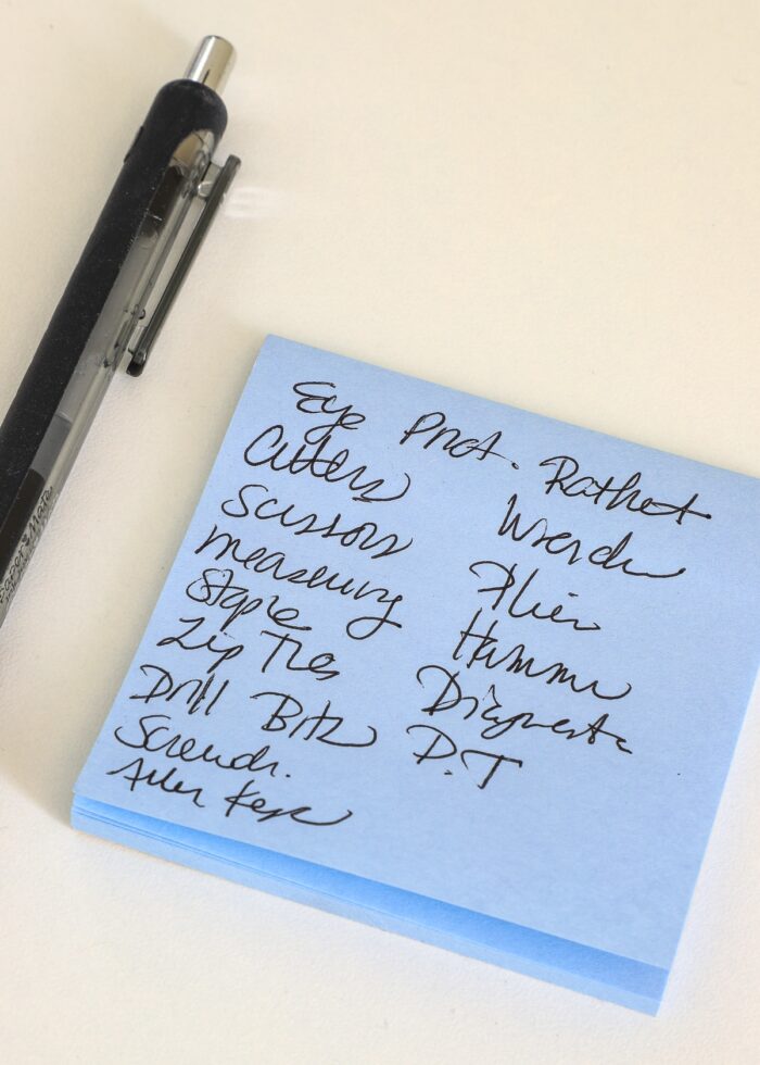 Post-It Notes with handwritten list of tool categories