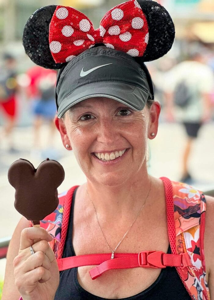 Megan with Minnie Mouse ears and a Mickey ice cream