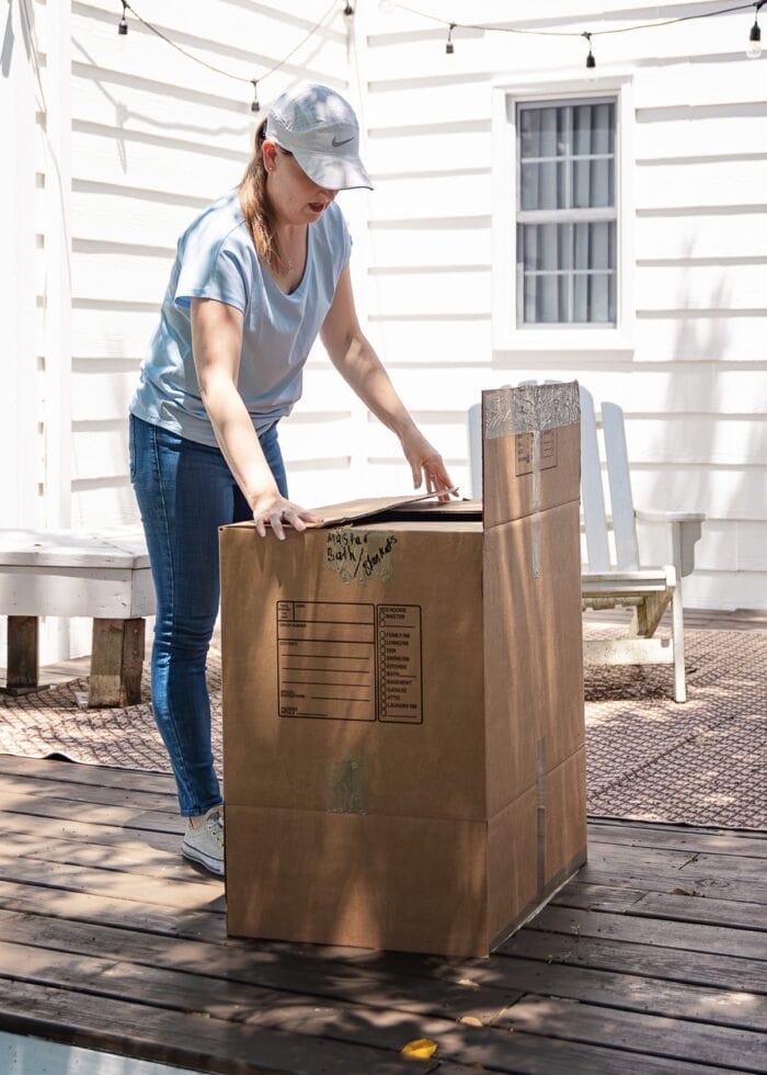 Megan packing a moving box