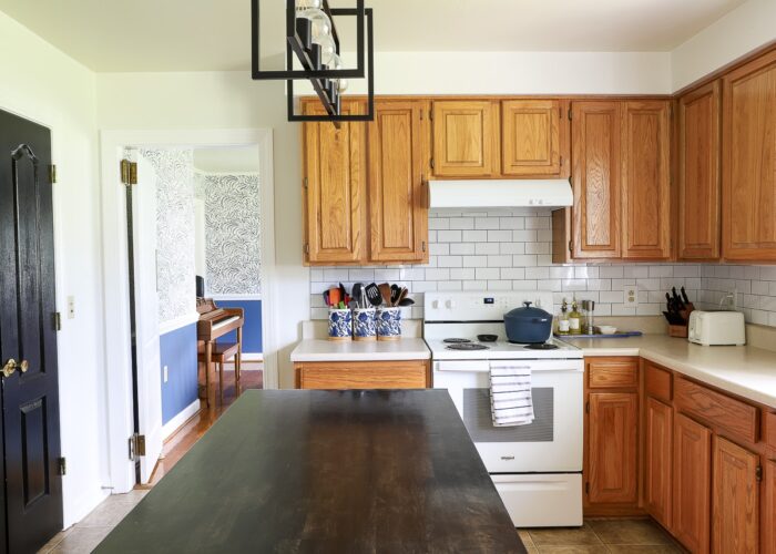 An oak rental kitchen filled with over a dozen renter friendly upgrades