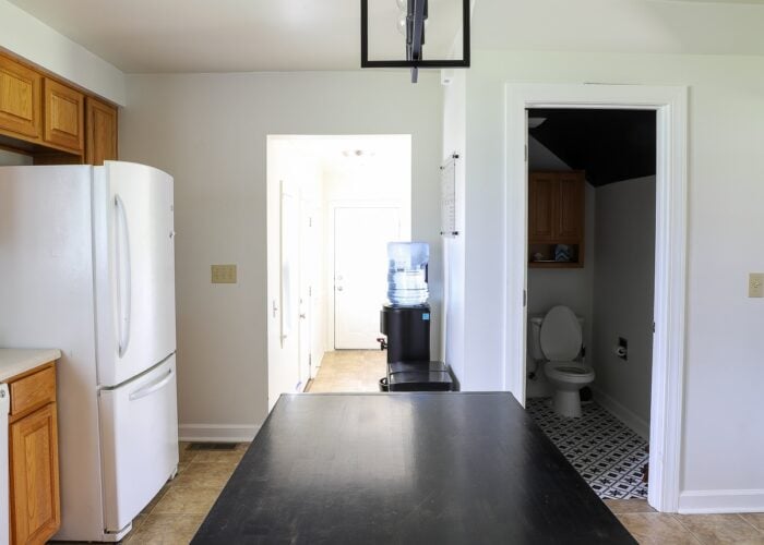 An oak rental kitchen filled with over a dozen renter friendly upgrades