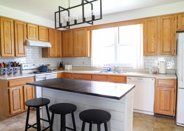 An oak rental kitchen filled with over a dozen renter friendly upgrades