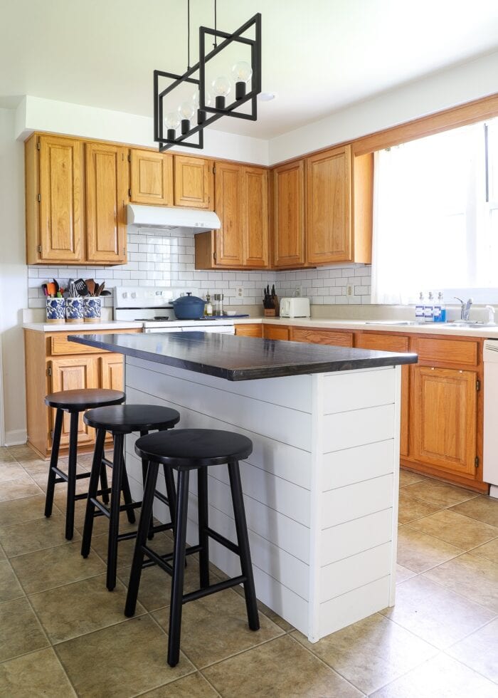 An oak rental kitchen modernized with white and black renter friendly upgrades