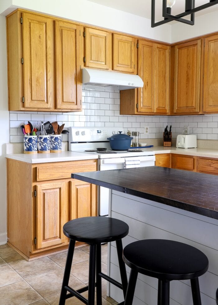 A rental kitchen filled with white and black renter friendly DIY projects