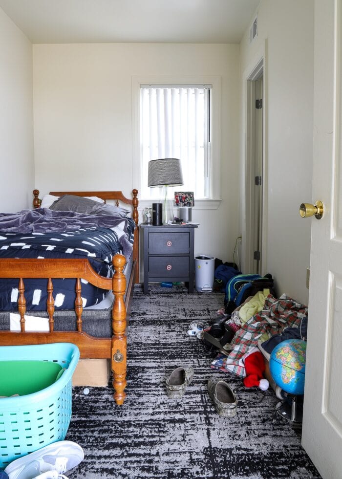 Small teen bedroom filled with clutter