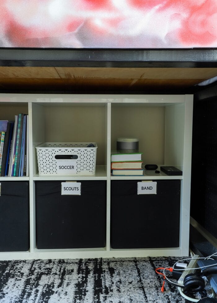 IKEA Kallax cube shelves tucked underneath a loft bed