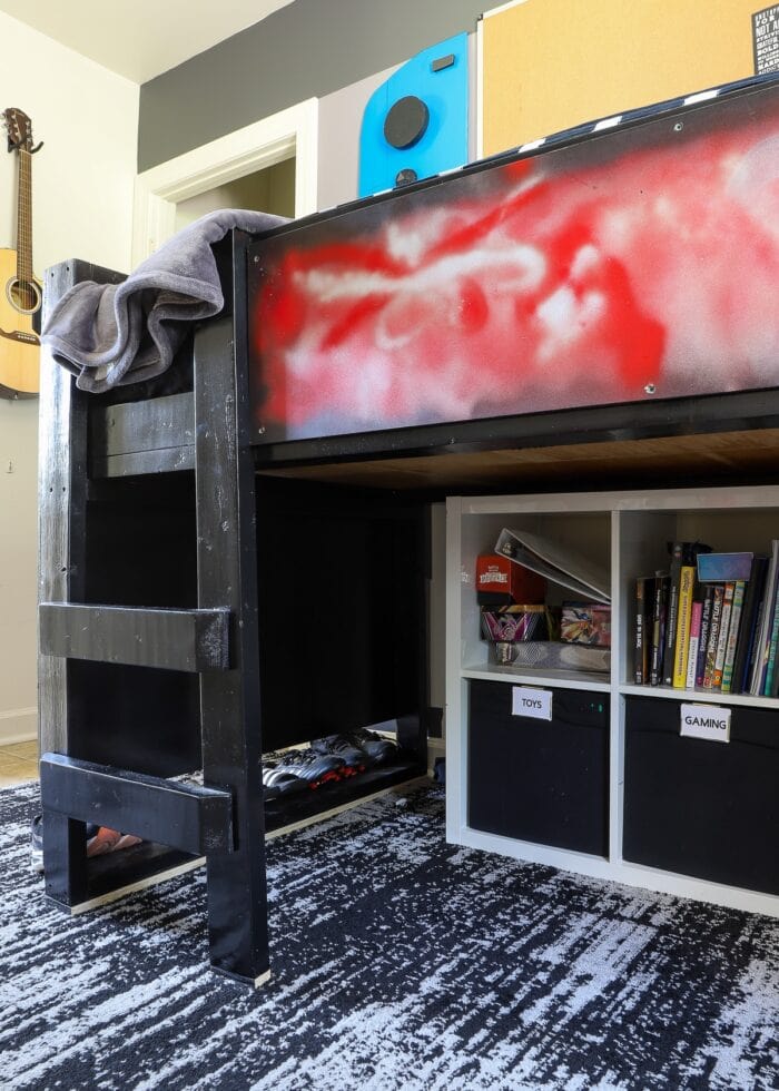 IKEA Kallax cube shelves tucked underneath a loft bed