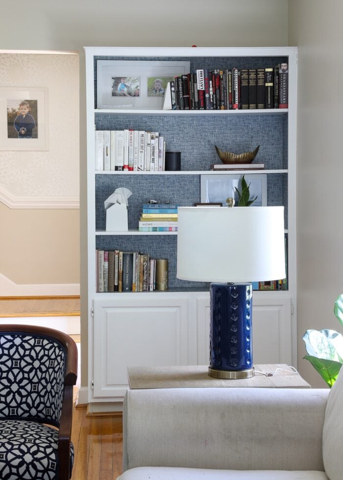 Built-in blue and white living room bookshelf