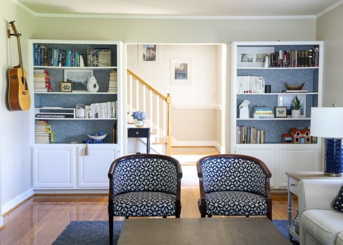 Built-in bookcases in a blue and white family room