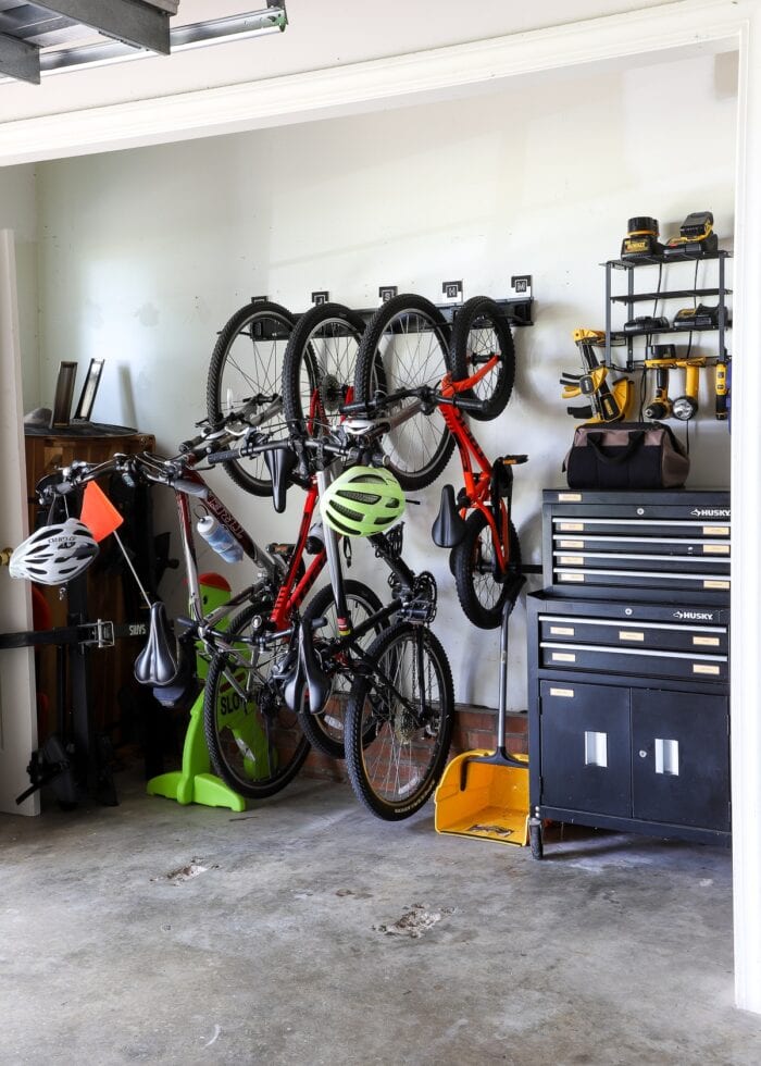 Bikes stored on the wall in an organized garage