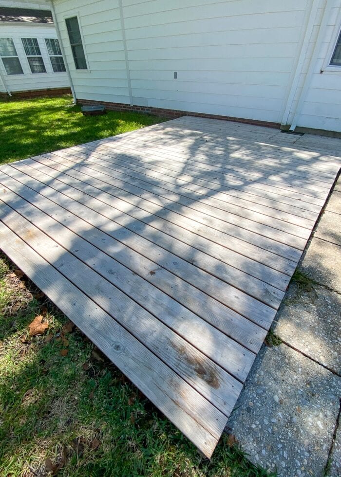 Unfinished wood deck in a backyard