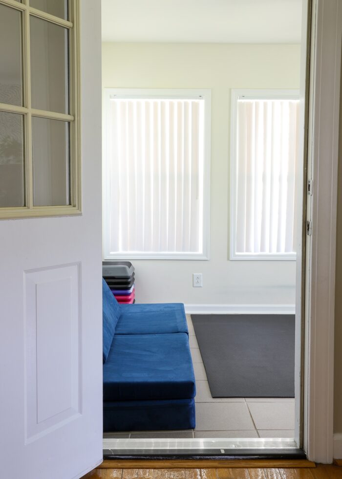 Carolina room door showing an exercise mat and blue Nugget inside