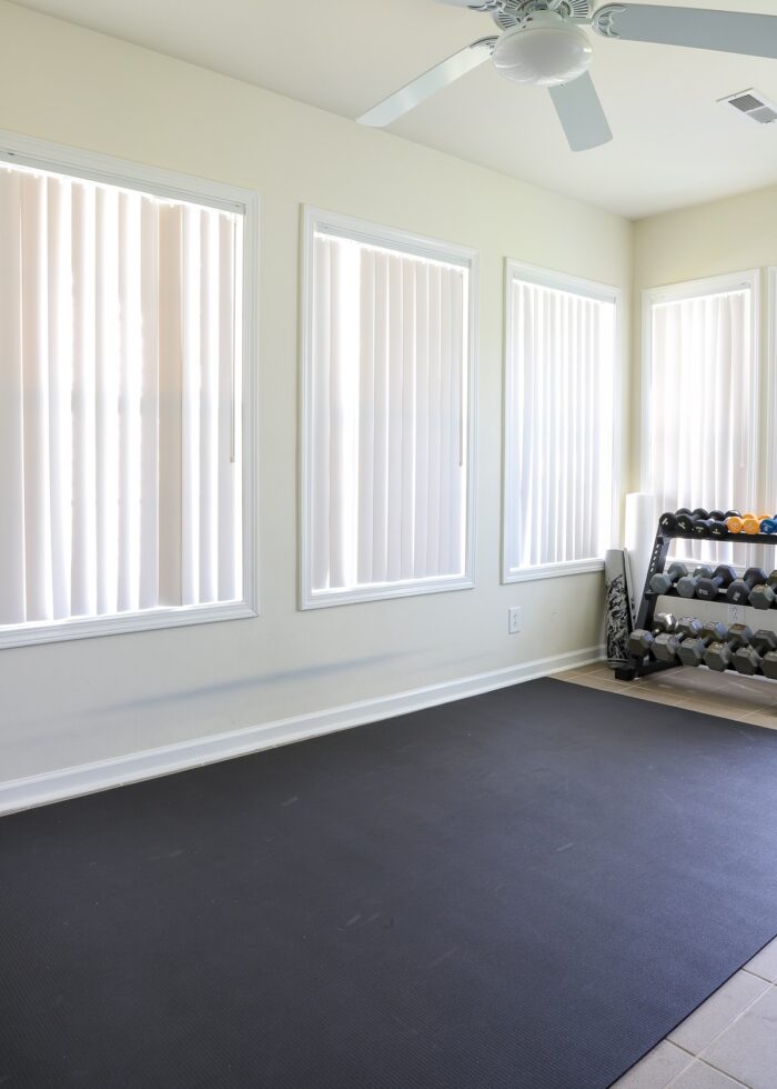 Carolina Room setup like an exercise room with mat and weights