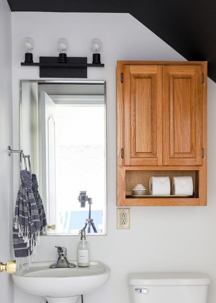Black ceilings and white walls in rental bathroom