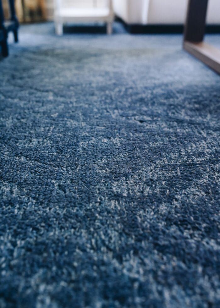 An up-close shot of a navy blue rug