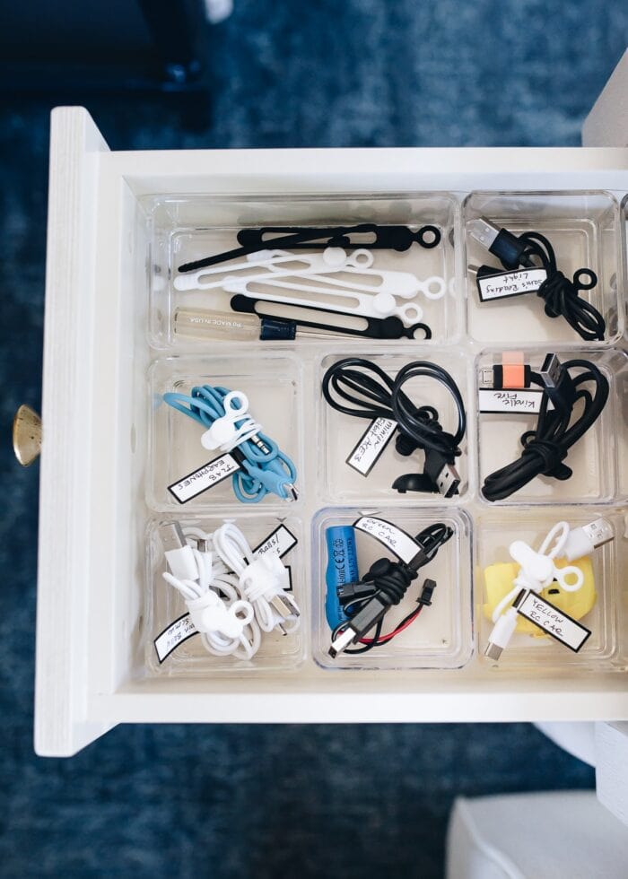 Labeled and organized cords organized in a side table drawer
