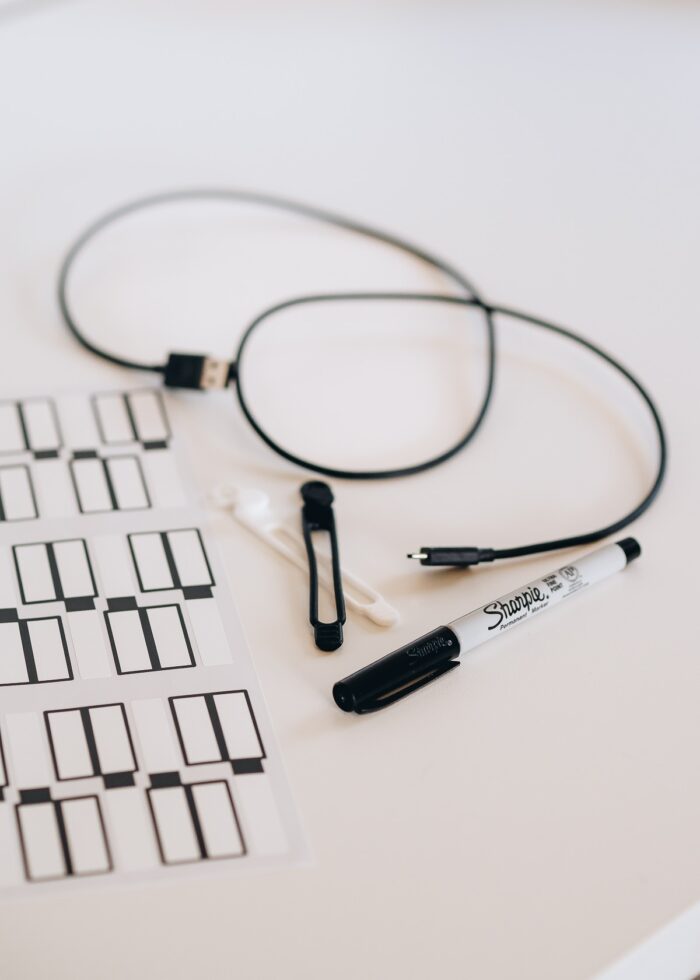 Cord organization labels and ties on a white table