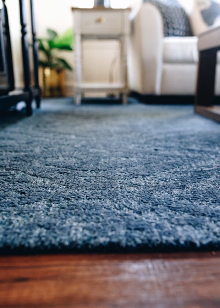 A close-up shot of a blue wool rug