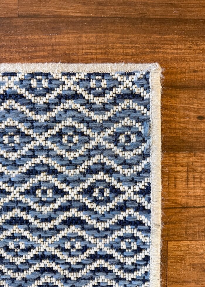 Up-close shot of machine rug binding