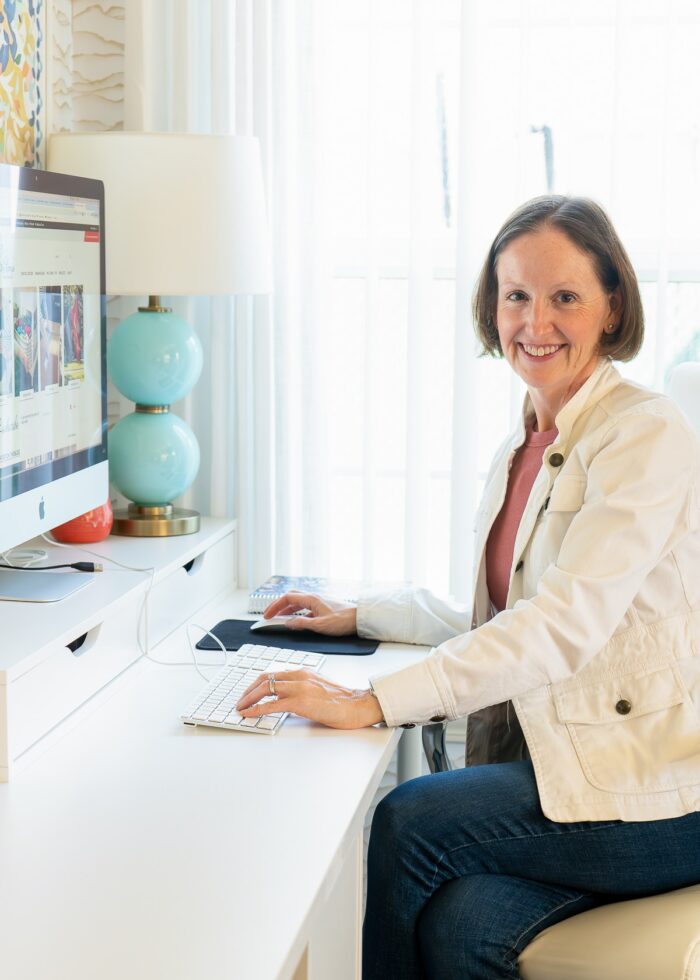 Megan from The Homes I Have Made sitting at a computer