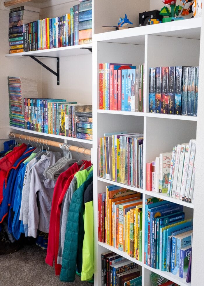 An organized kids' closet filled with books