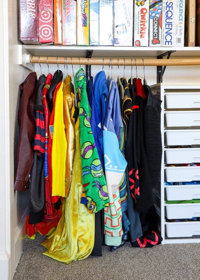 Costumes hung up in a playroom closet