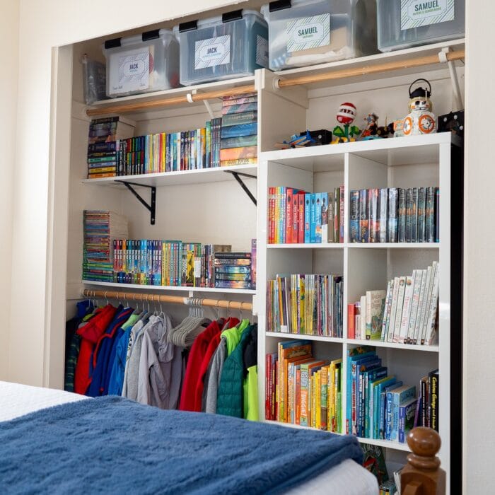 An organized kids' closet filled with books