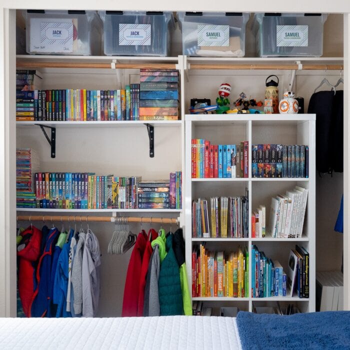 An organized kids' closet filled with books