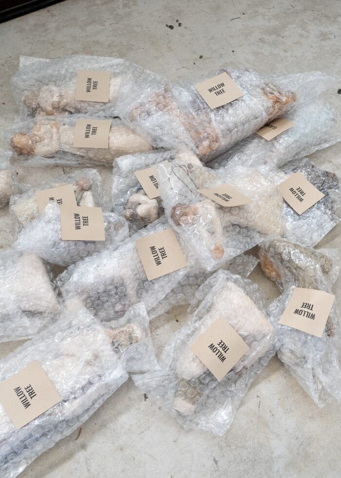 Various Nativity pieces wrapped in bubble wrap pouches and labeled with square stickers