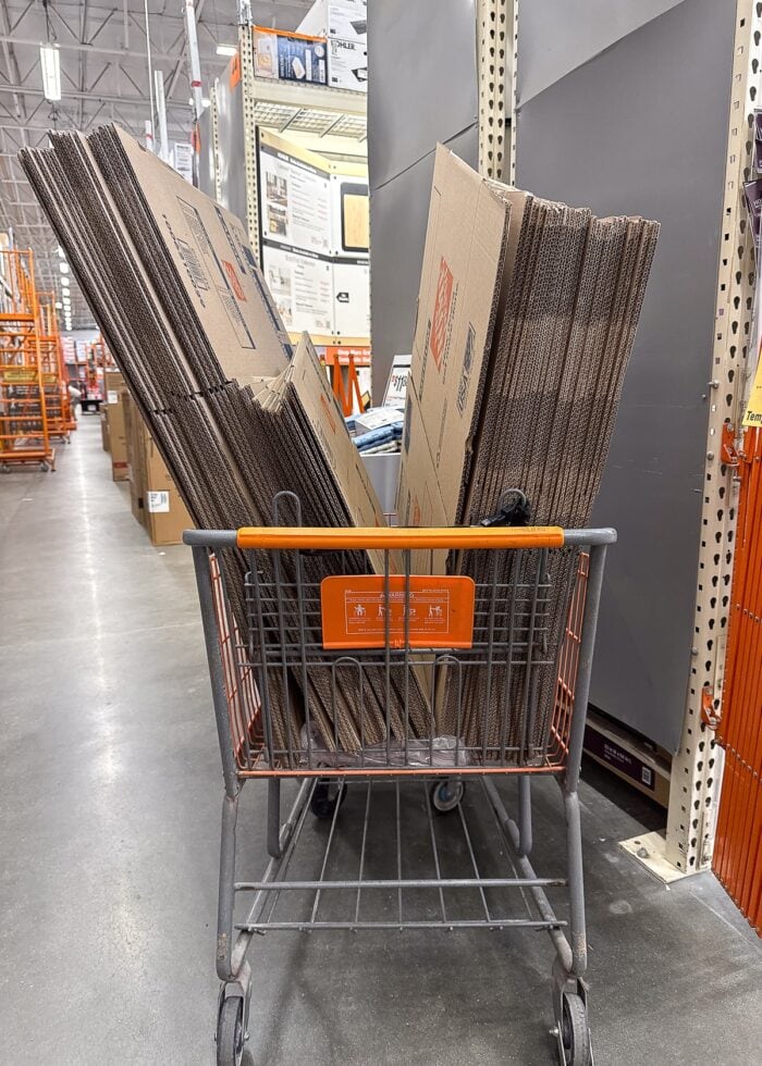 Shopping cart full of moving boxes at The Home Depot