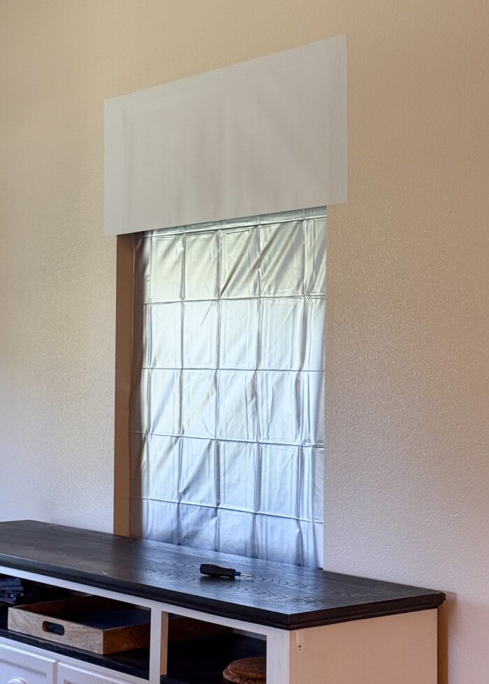 Wallpaper partially covering up a blocked window