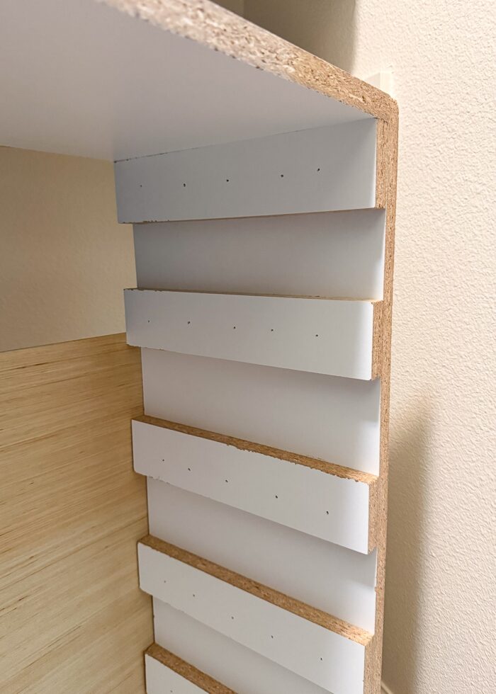 A detailed shot of the inside returns on a simple DIY shoe storage shelf