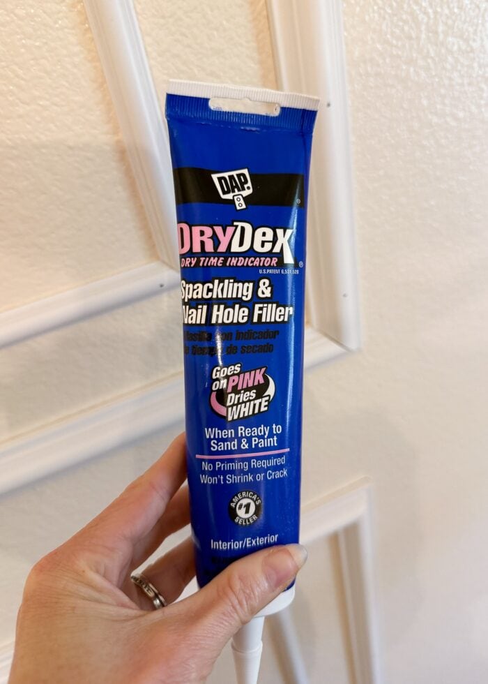Megan holding a blue tube of DryDex