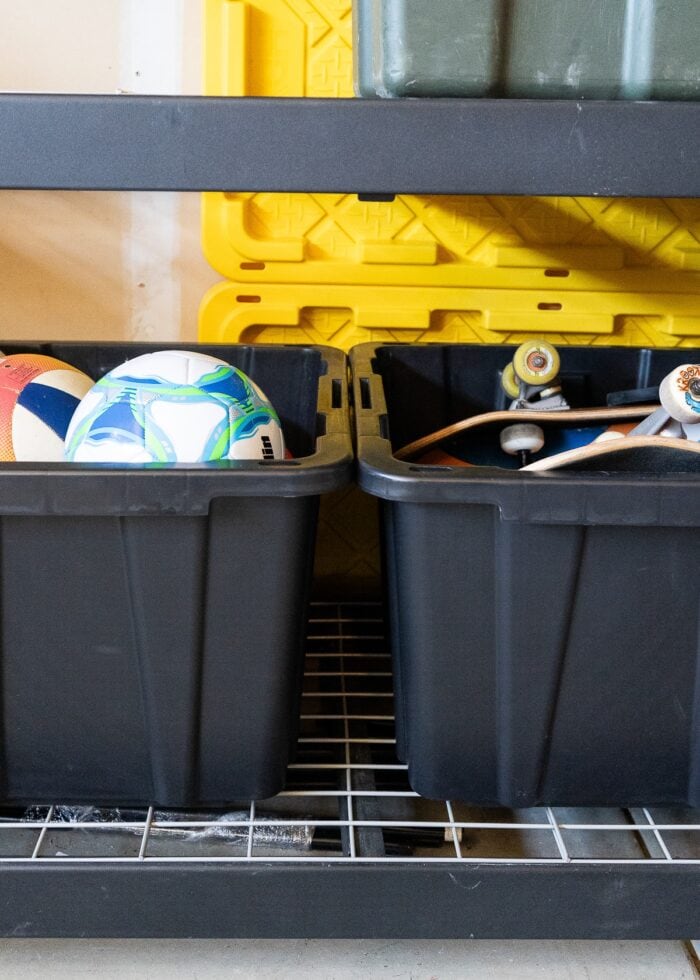 Two 40 gallon HDX tubs edge to edge on a set of garage shelves
