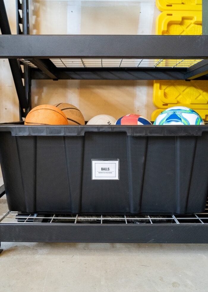 A 40 gallon HDX bin used as a ball tub in a garage