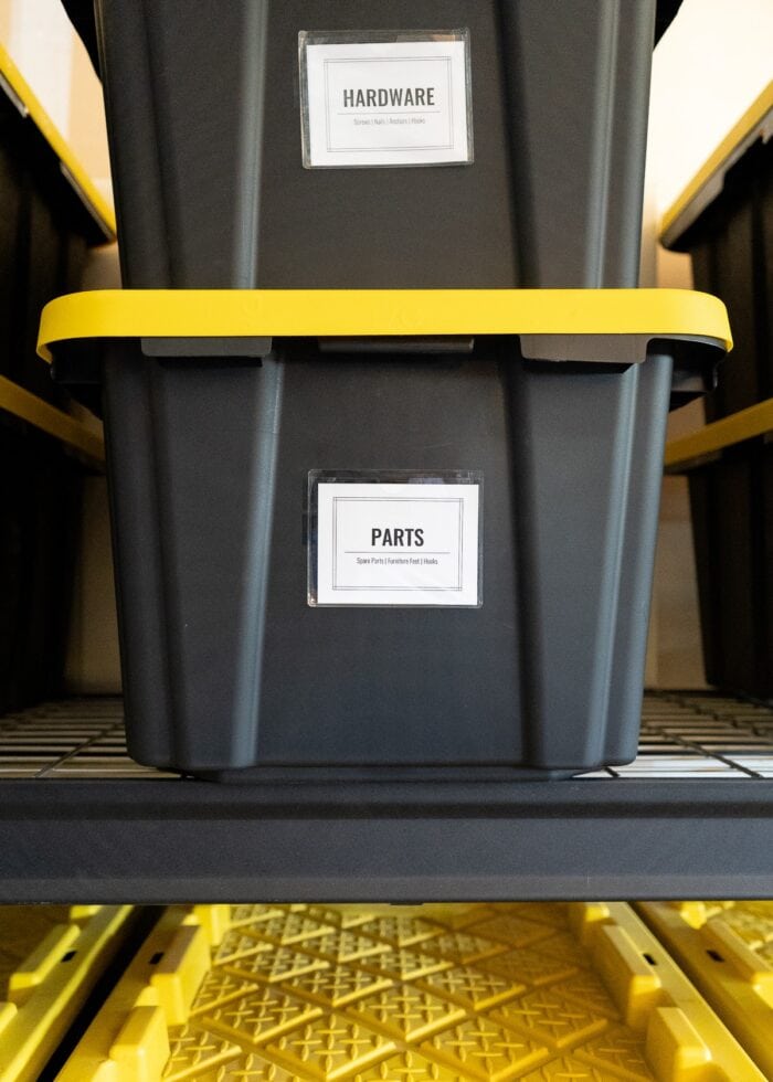 An 17 gallon HDX bin on a black shelf with a bright white label