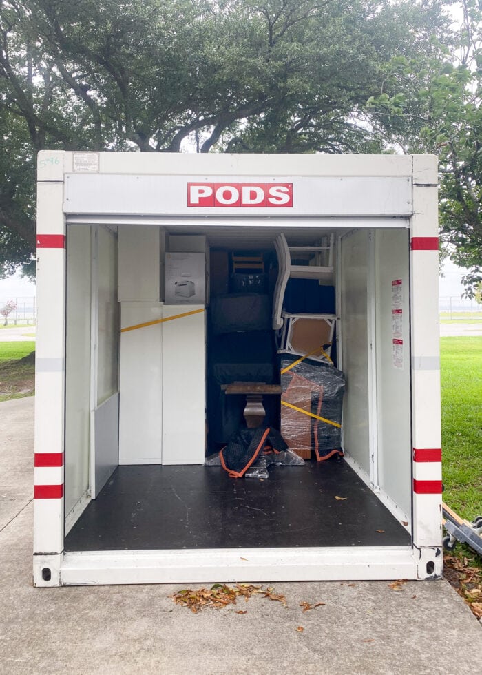 A PODS storage container partially filled with items.